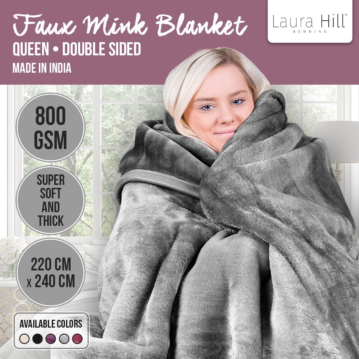 Blonde Lady warm and snug in grey fake mink fluffy blanket by Laura hill.